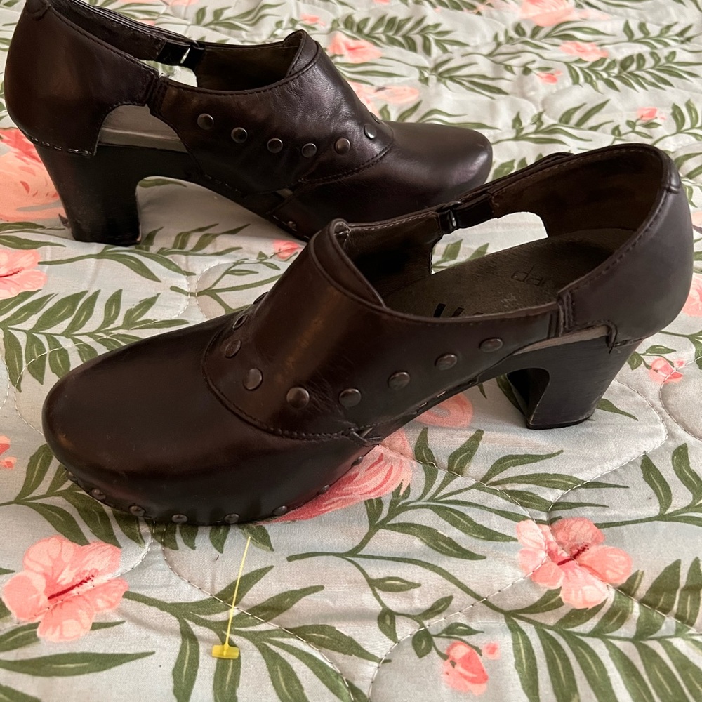 Unique Dansko women’s black clogs with slight heel.